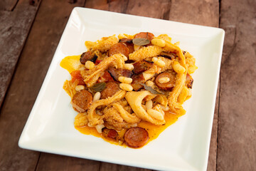 Beef tripe (bucho), beef stomach, tripe on a white plate. Dobradinha