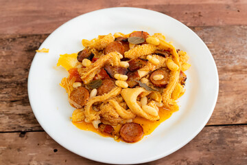 Beef tripe (bucho), beef stomach, tripe on a white plate. Dobradinha