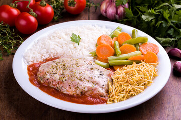 Delicious Brazilian Meal With Rice Vegetables and Meat Cutlet