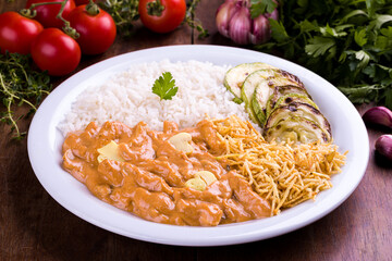 Delicious Brazilian Strogonoff With Rice and Vegetables Plated