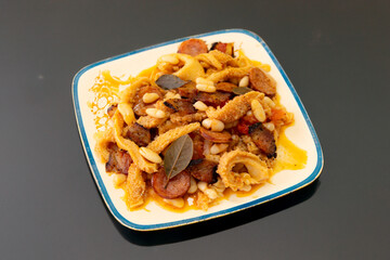 Beef tripe (bucho), beef stomach, tripe on a white plate. Dobradinha