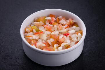 Fresh Diced Vegetable Condiment in White Ceramic Bowl