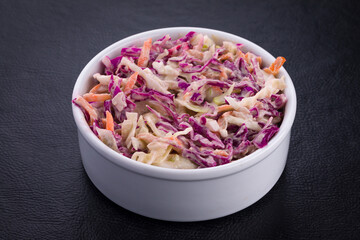 Fresh Creamy Coleslaw in a White Ceramic Bowl
