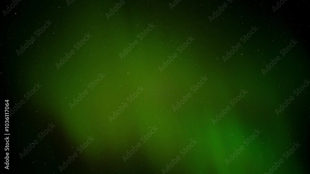 Wall mural green aurora with hints of red flashing in a starry sky with only the sky in the frame, time lapse.