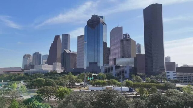 Downtown Houston Texas revealed by rising drone from west side.