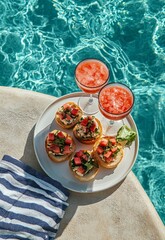 Delicious canapes by the poolside with refreshing drinks and summer vibes in bright sunlight © olegganko