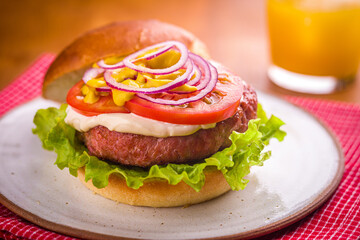 Delicious Fresh Sausage Burger with Vegetables on a Plate