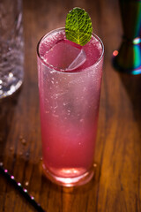 Refreshing Pink Cocktail With Ice and Mint Garnish