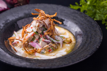 Gourmet Fusion Dish with Creamy Sauce and Crispy Onions