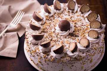 Delicious Chocolate Garnished Cake with Creamy Toppings