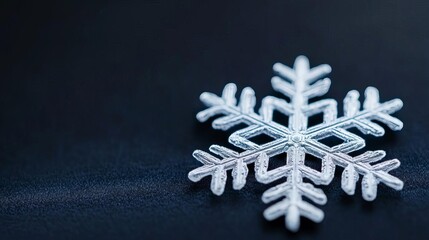 Macro shot of intricate snowflake on velvet, luxury and nature