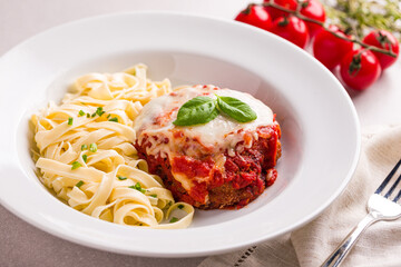 Delicious Chicken Parmesan With Tagliatelle And Fresh Basil