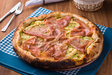 Delicious Italian Pizza with Prosciutto on Gingham Tablecloth