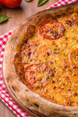 Delicious Homemade Tomato and Cheese Pizza on Wooden Table