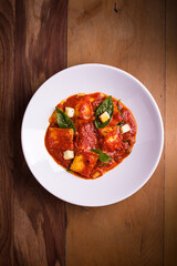 Delicious Ravioli in Rich Tomato Sauce with Fresh Basil Garnish