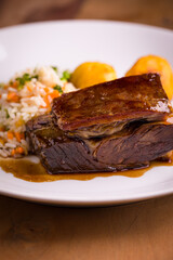 Delicious Beef Ribs Served With Flavored Rice and Vegetables