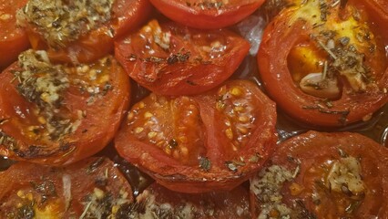 Close-up of seasoned roasted tomatoes with crispy edges