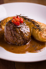Gourmet Beef Tenderloin with Sauce and Vegetables on Elegant Plate
