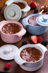 Delicious Chocolate Dessert in Colorful Ramekins with Fresh Berries