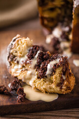 Delicious Choc Chip Panettone with Creamy Drizzle on Wooden Board
