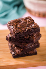 Delicious Homemade Chocolate Brownies Stacked on Wooden Board