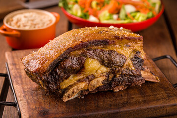 Delicious Roasted Meat with Crispy Skin and Fresh Side Dishes