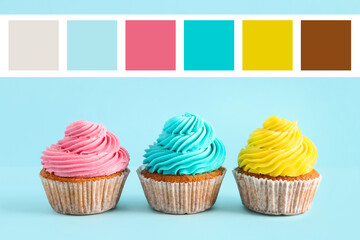 Tasty colorful cupcakes on blue background
