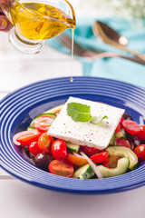 Fresh Greek Salad with Feta Cheese and Olive Oil Drizzle