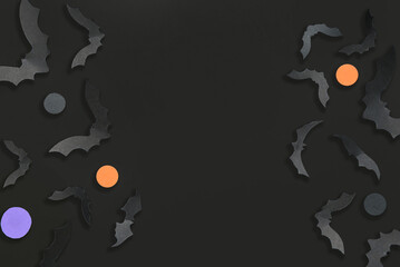 Paper bats for Halloween party on dark background