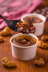 Delicious Chocolate Pudding Dessert in White Cup with Toppings