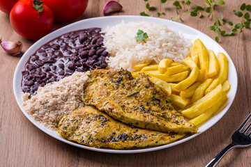 Delicious Grilled Chicken Meal with Rice and Sides on White Plate