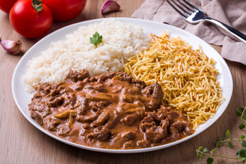 Delicious Brazilian Stroganoff with Rice and Potato Sticks