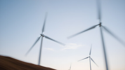 A conceptual image of wind energy, with blurred motion of turbine blades spinning against a clear sky, symbolizing the generation of clean power. Generative AI