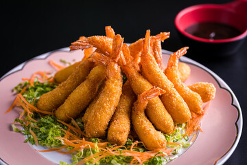 Crispy Fried Shrimp with Fresh Lettuce and Carrot Garnish