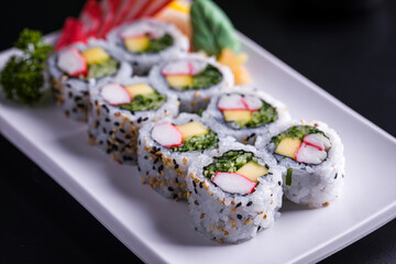 Fresh and Delicious Sushi Rolls on White Platter