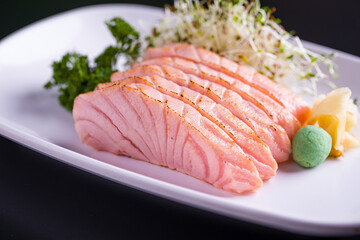 Delicious Slices of Fresh Sushi with Wasabi and Garnish