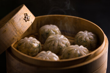 Steaming Hot Dumplings in Traditional Bamboo Steamer