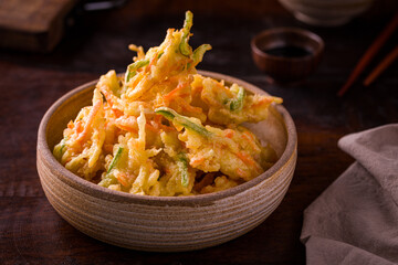 Crispy Vegetable Tempura in a Rustic Wooden Bowl on Wooden Table