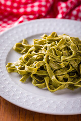 Delicious Homemade Spinach Fettuccine on a Elegant White Plate