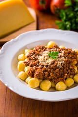 Delicious Gnocchi with Rich Meat Sauce and Fresh Cheese Garnish