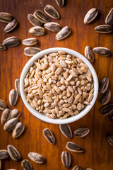 Sunflower Seeds in a Bowl on Wooden Background