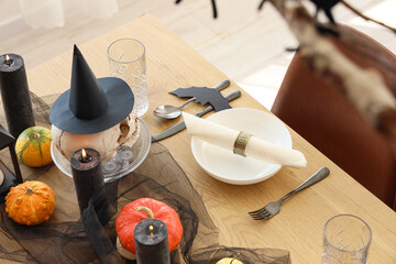 Beautiful table setting with folded napkin for Halloween party