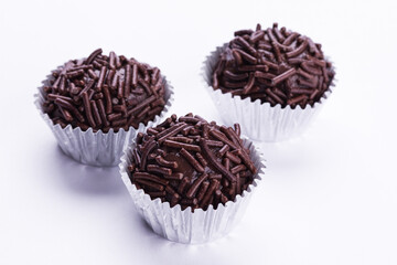 Delicious Brazilian Brigadeiros with Chocolate Sprinkles on White Background
