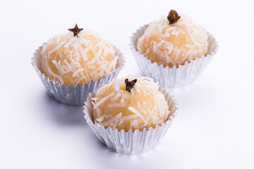 Delicious Beijinho Coconut Truffle Sweets in Silver Foil Cups on White Background