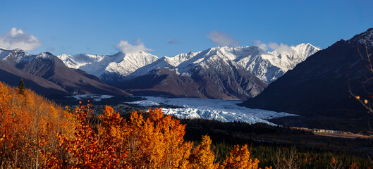 Snow covered mountains and Matanuska Glacier along Glen highway in Alaska during autumn time.