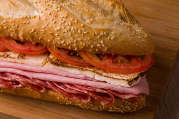 Delicious Bauru Sandwich With Ham, Tomato, and Cheese on Sesame Bread