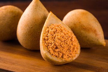 Delicious Brazilian Coxinha on Wooden Surface Close Up