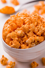 Delicious Cheddar Cheese Gourmet Popcorn in a White Ceramic Bowl