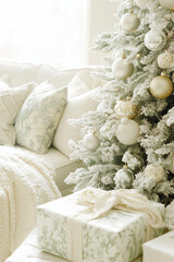 Beautifully wrapped gifts with bows by the Christmas tree