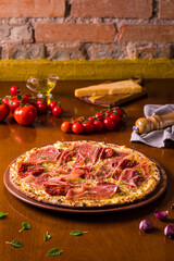 Delicious Prosciutto Pizza with Fresh Tomatoes and Garlic